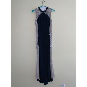 Navy blue gown, studded down the sides.